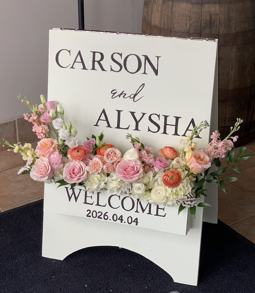 Tangle Creek wedding welcome sign with florals